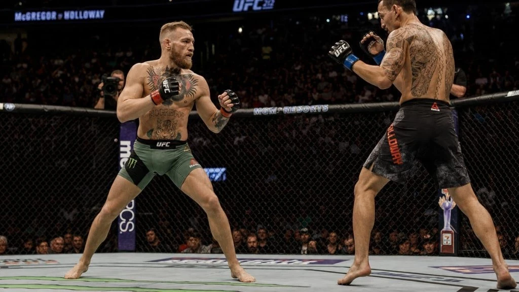 UFC 329: Maks Hollouey Konor Makqreqoru texniki nokautla məğlub edib